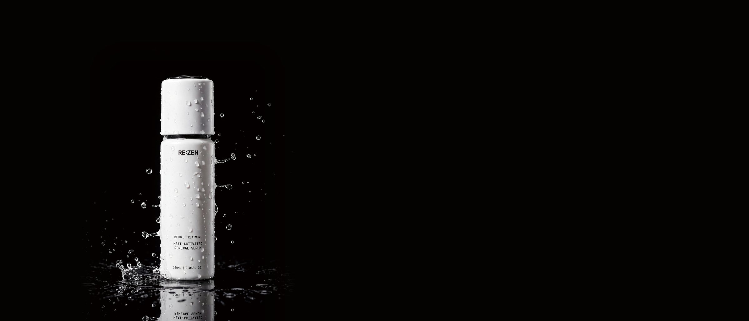 A white serum bottle beaded with water on black, droplets splashing around it